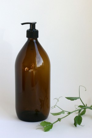 Brun pumpeflaske i glass, 1 liter (uten innhold)